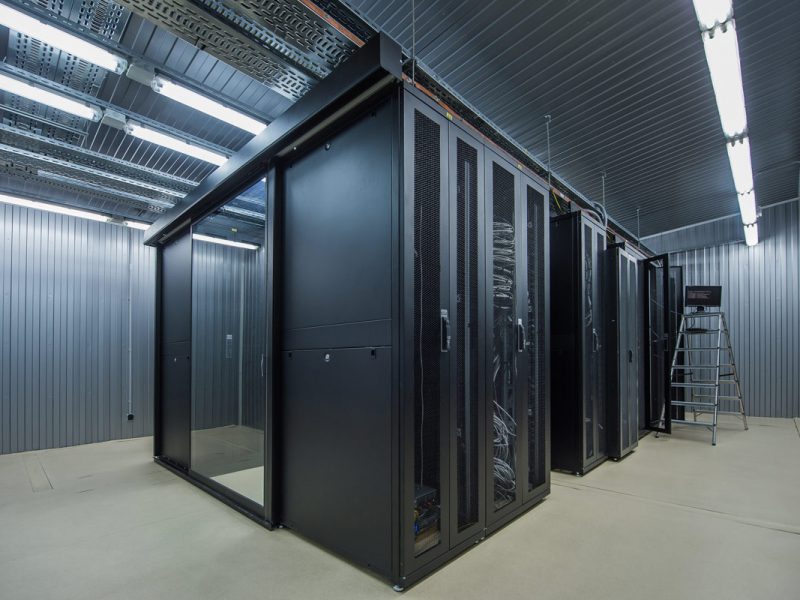 Hot Aisle Containment System in Data Center with Slab Floor and LED Lighting